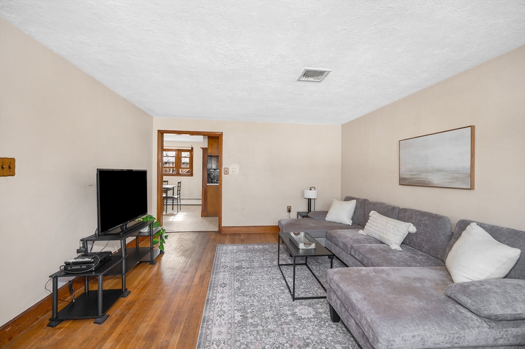7 Marie Street Methuen, MA 01844 - Photo 11 of 39 a living room with furniture and a flat screen tv