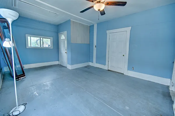 a view of an empty room with a window
