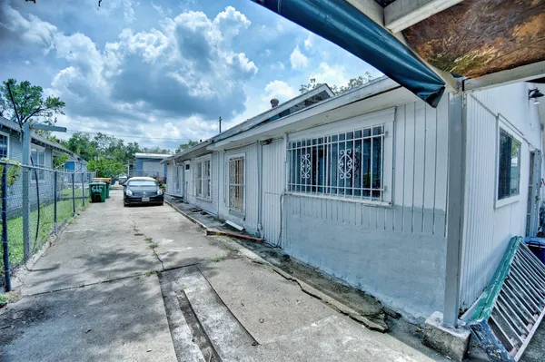 a view of a porch with furniture and a garage