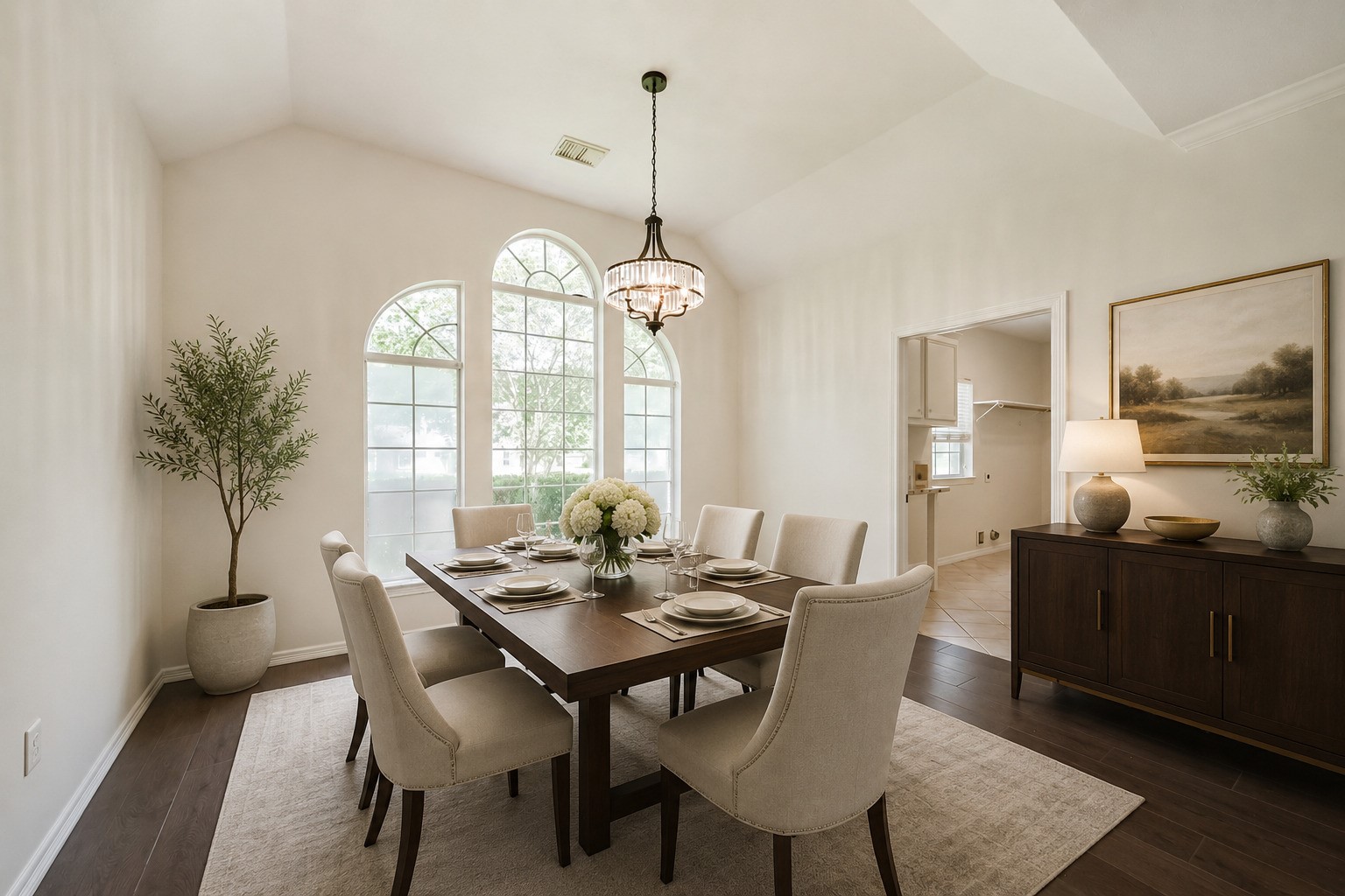 27322 Afton Way Huffman, TX 77336 - Photo 6 of 50 *Virtually staged - Formal dining room is highlighted by soaring ceilings, oversized arched windows, and elegant lighting, creating the perfect setting for entertaining.
