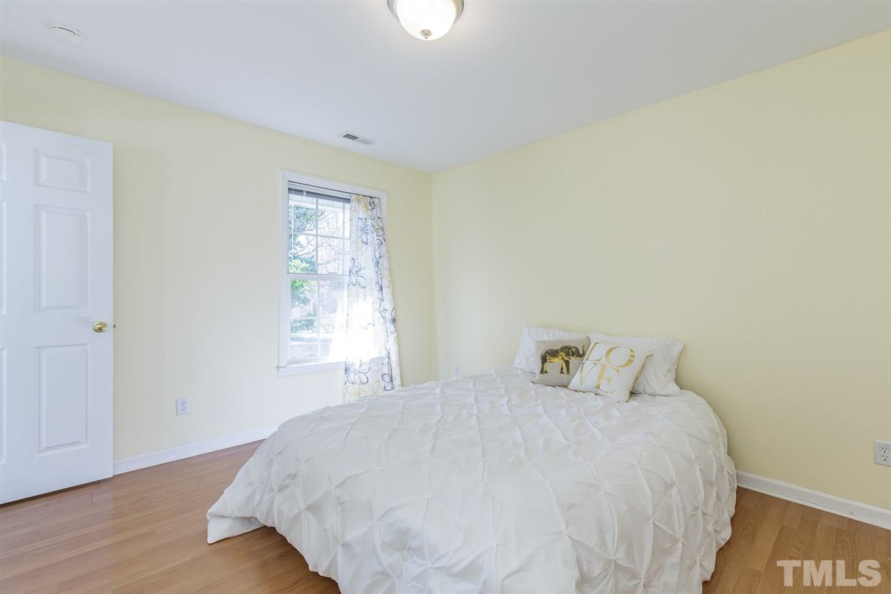 4105 Neal Road, Unit C Durham, NC 27705 - Photo 12 of 22 a bedroom with a bed and a window