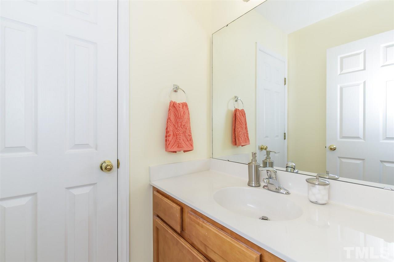 4105 Neal Road, Unit C Durham, NC 27705 - Photo 13 of 22 a bathroom with a sink and a mirror
