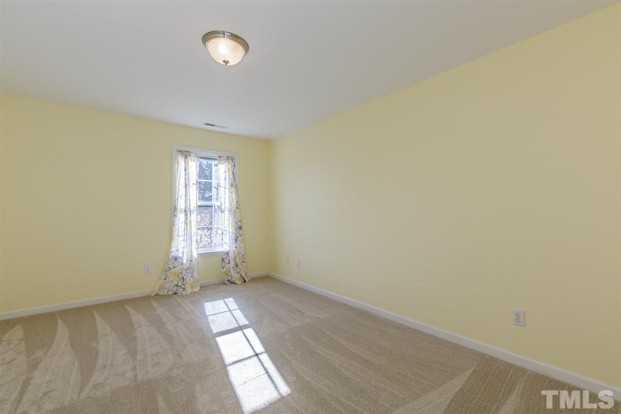 4105 Neal Road, Unit C Durham, NC 27705 - Photo 17 of 22 an empty room with windows