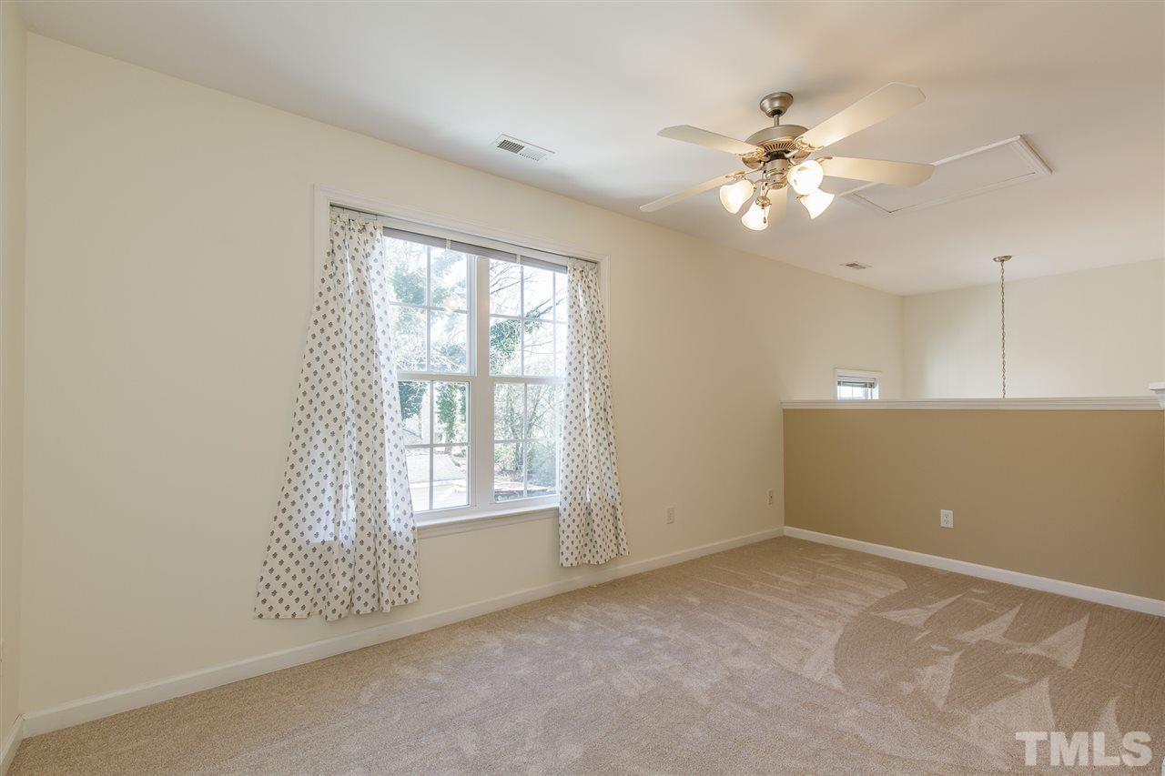 4105 Neal Road, Unit C Durham, NC 27705 - Photo 19 of 22 a view of an empty room with a window