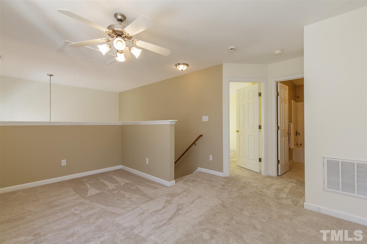 4105 Neal Road, Unit C Durham, NC 27705 - Photo 20 of 22 an empty room with chandelier fan