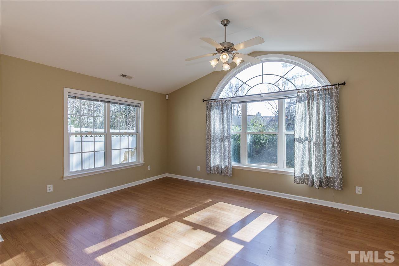 4105 Neal Road, Unit C Durham, NC 27705 - Photo 3 of 22 a view of an empty room with wooden floor and a window