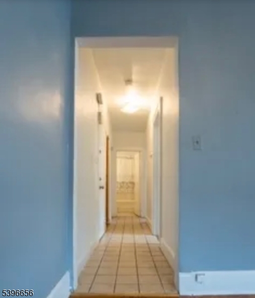 26 Dodd Street Bloomfield, NJ 07003 - Photo 2 of 5 a view of a hallway with wooden floor