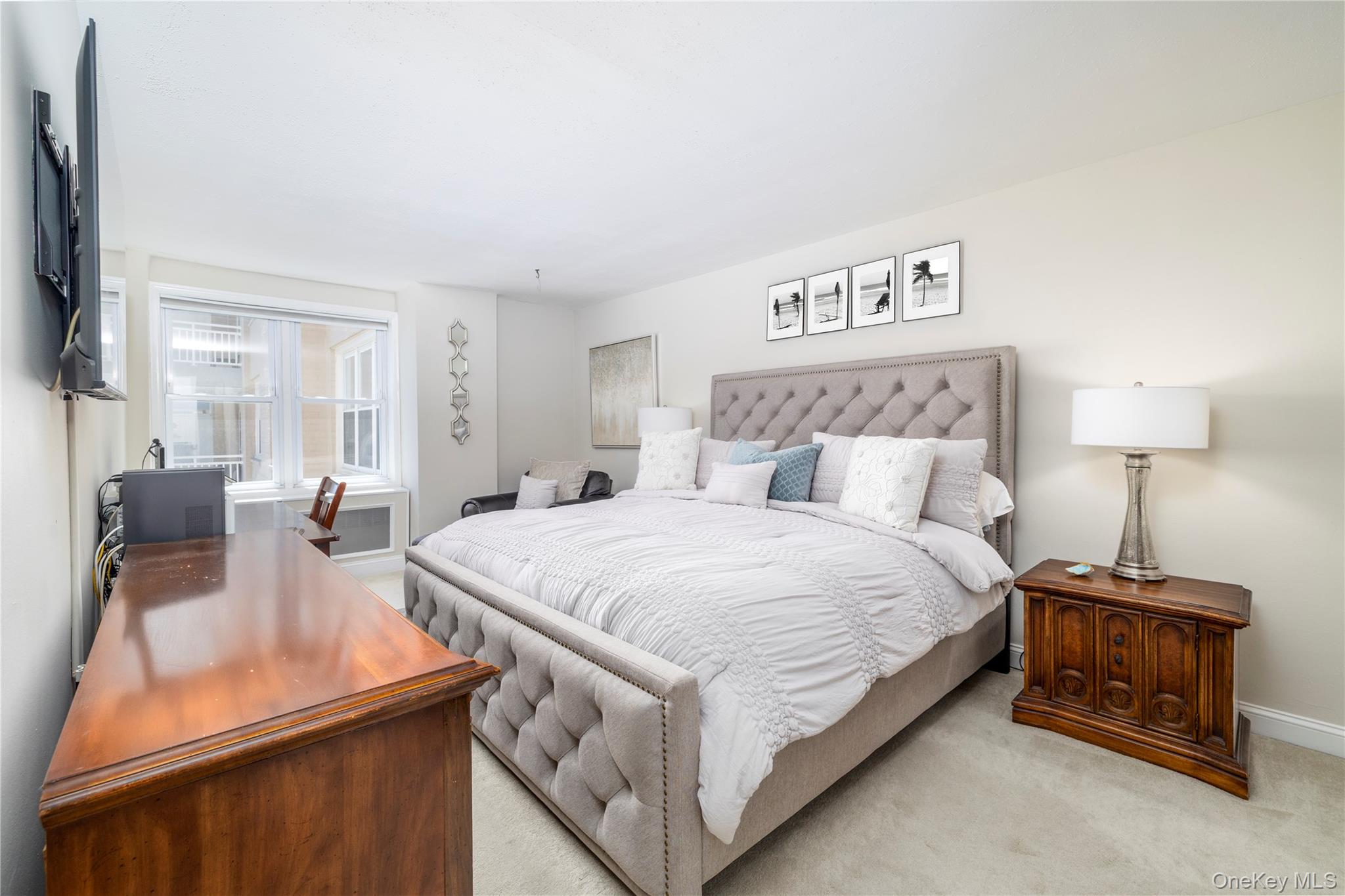 522 Shore Road, Unit 4W Long Beach, NY 11561 - Photo 16 of 33 Bedroom featuring baseboards and light colored carpet