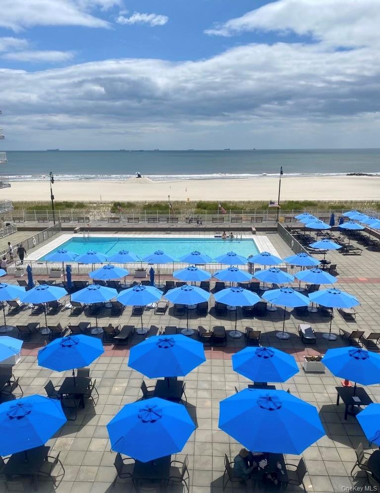 522 Shore Road, Unit 4W Long Beach, NY 11561 - Photo 33 of 33 Community pool featuring view of water and beach