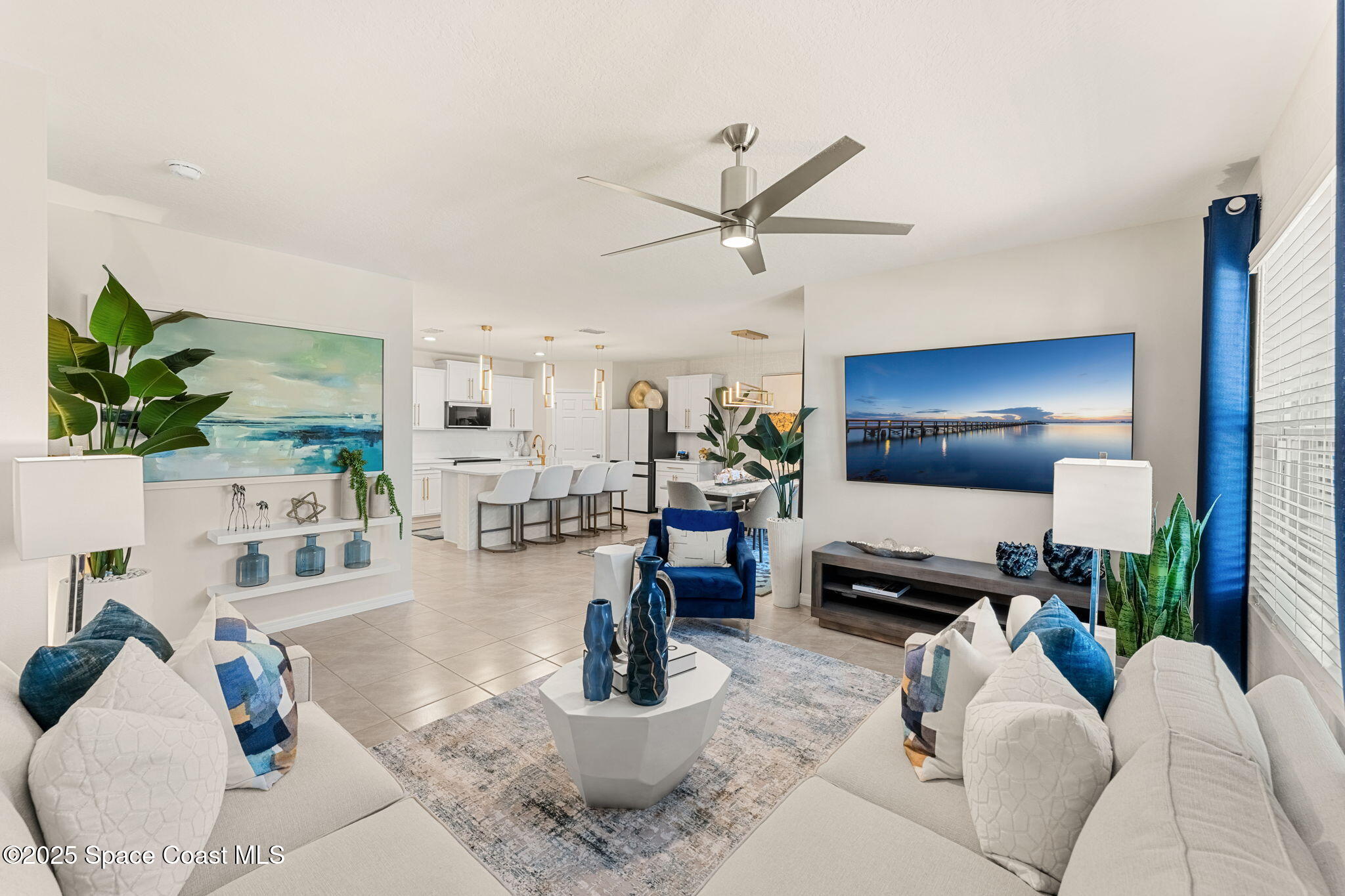 2013 Farmhouse Road Southeast Palm Bay, FL 32909 - Photo 13 of 37 a living room with furniture and a flat screen tv