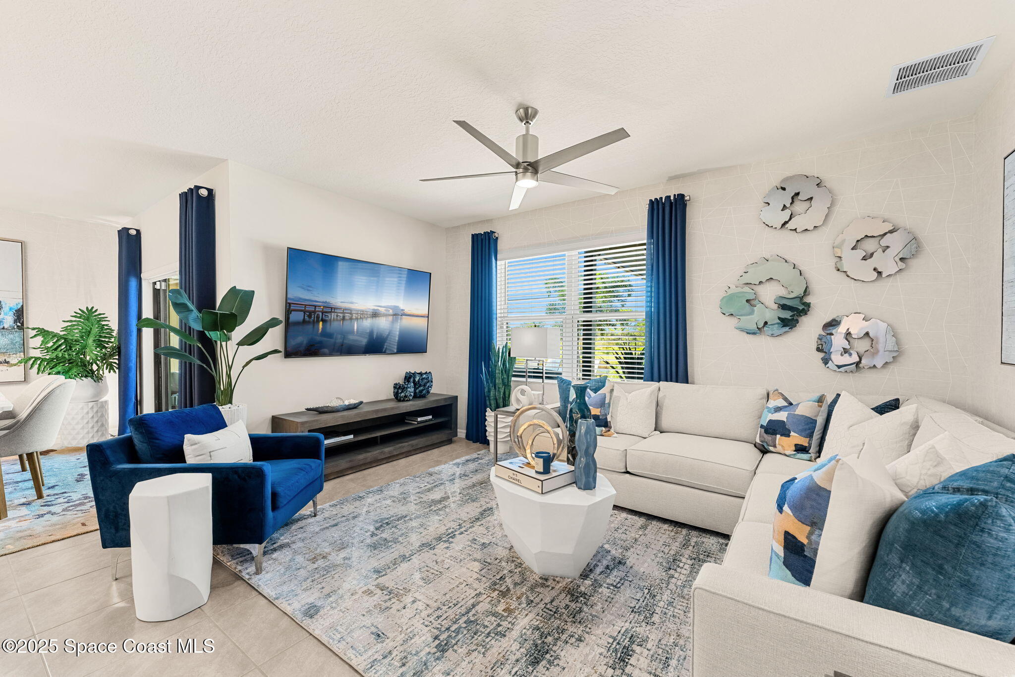 2013 Farmhouse Road Southeast Palm Bay, FL 32909 - Photo 15 of 37 a living room with furniture and a large window