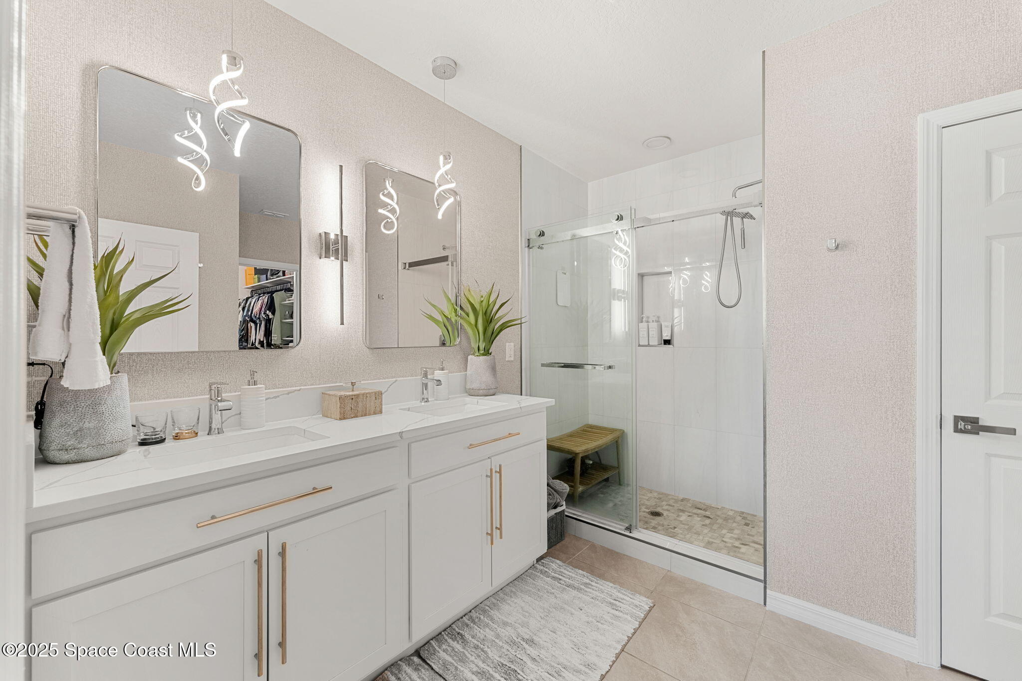 2013 Farmhouse Road Southeast Palm Bay, FL 32909 - Photo 18 of 37 a spacious bathroom with a double vanity sink mirror and shower