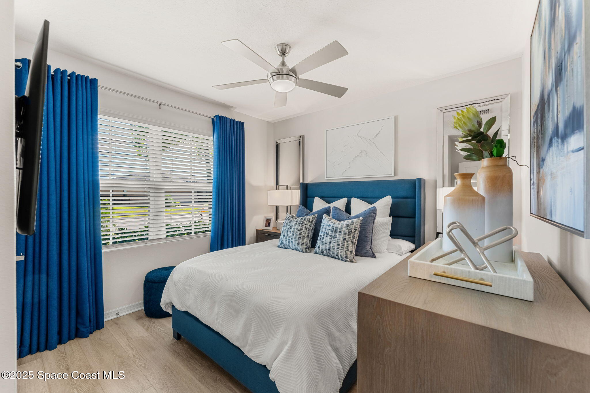 2013 Farmhouse Road Southeast Palm Bay, FL 32909 - Photo 20 of 37 a bedroom with a large bed and a window