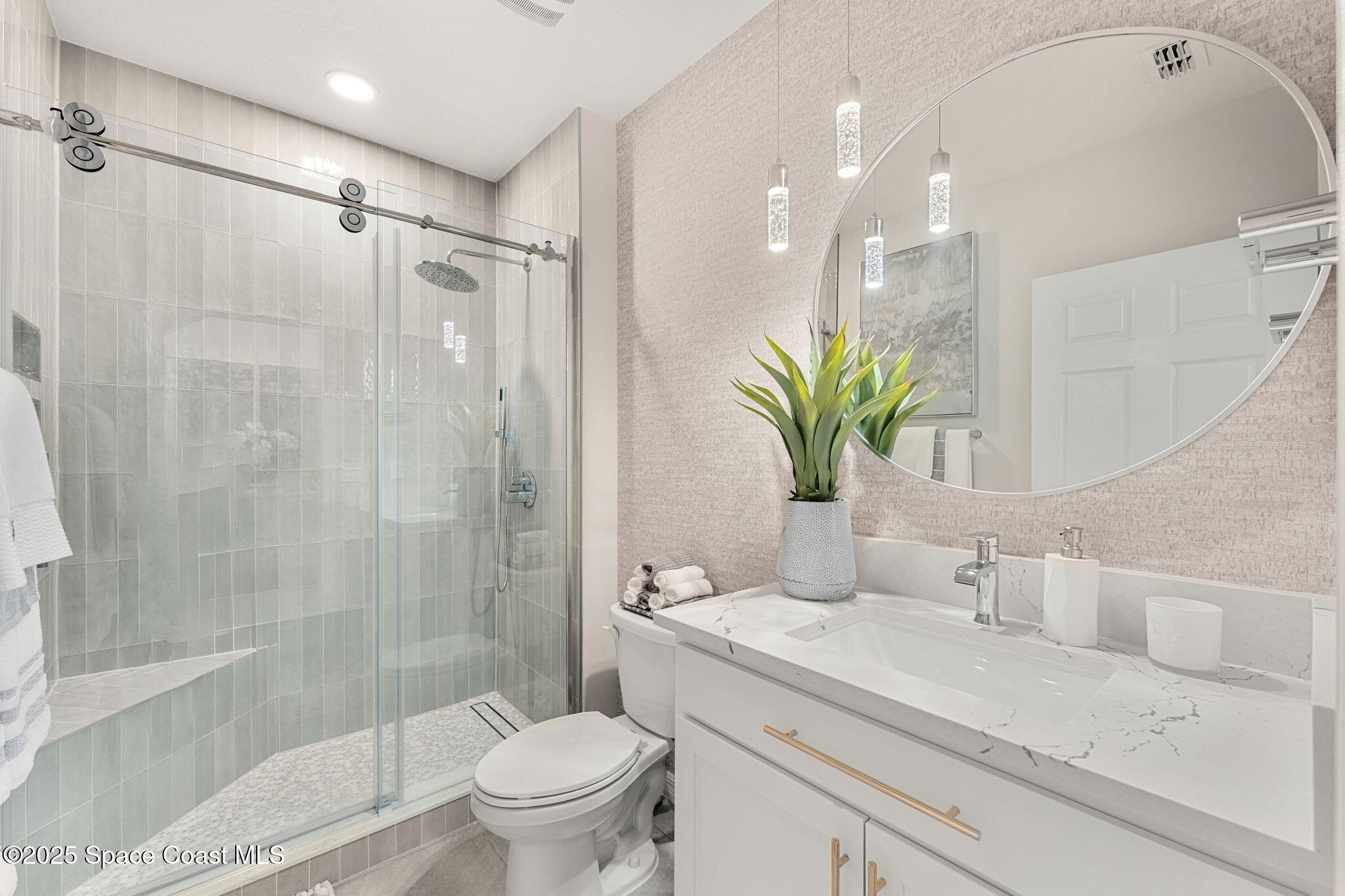 2013 Farmhouse Road Southeast Palm Bay, FL 32909 - Photo 21 of 37 a bathroom with a granite countertop sink a toilet and shower