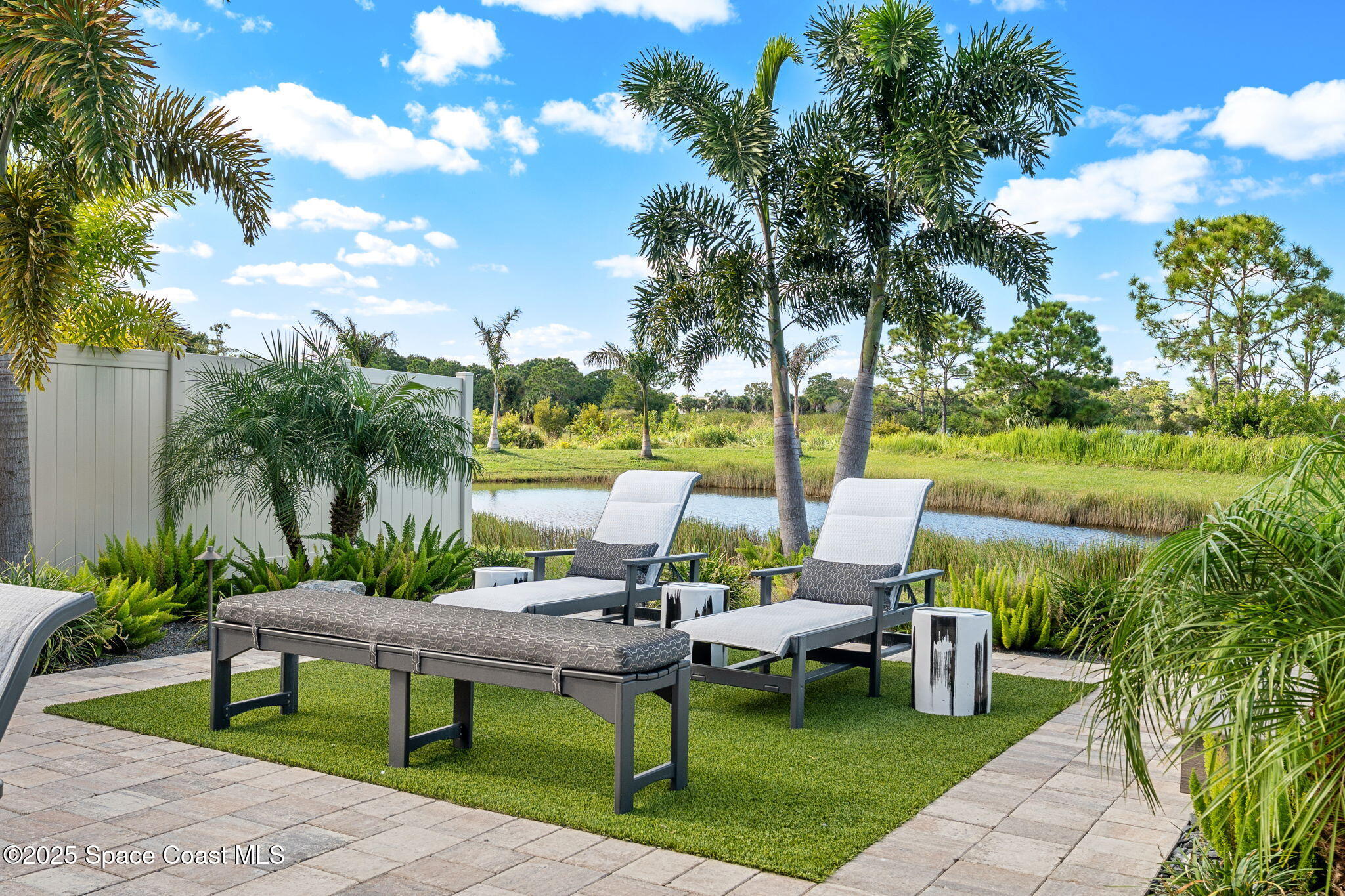 2013 Farmhouse Road Southeast Palm Bay, FL 32909 - Photo 29 of 37 a view of a garden with plants and lounge chair