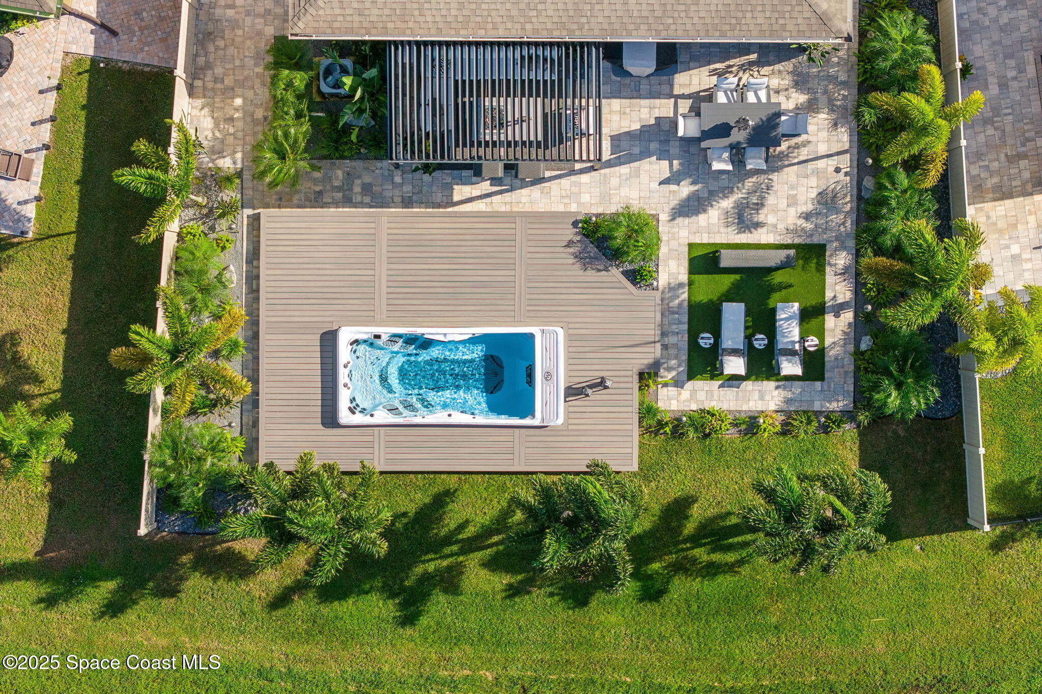 2013 Farmhouse Road Southeast Palm Bay, FL 32909 - Photo 30 of 37 front view of house with a yard and potted plants