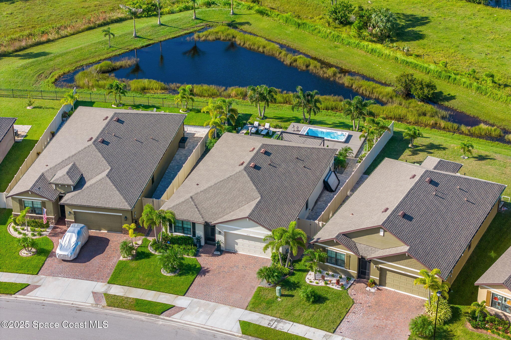 2013 Farmhouse Road Southeast Palm Bay, FL 32909 - Photo 33 of 37 an aerial view of a house with yard swimming pool and outdoor seating