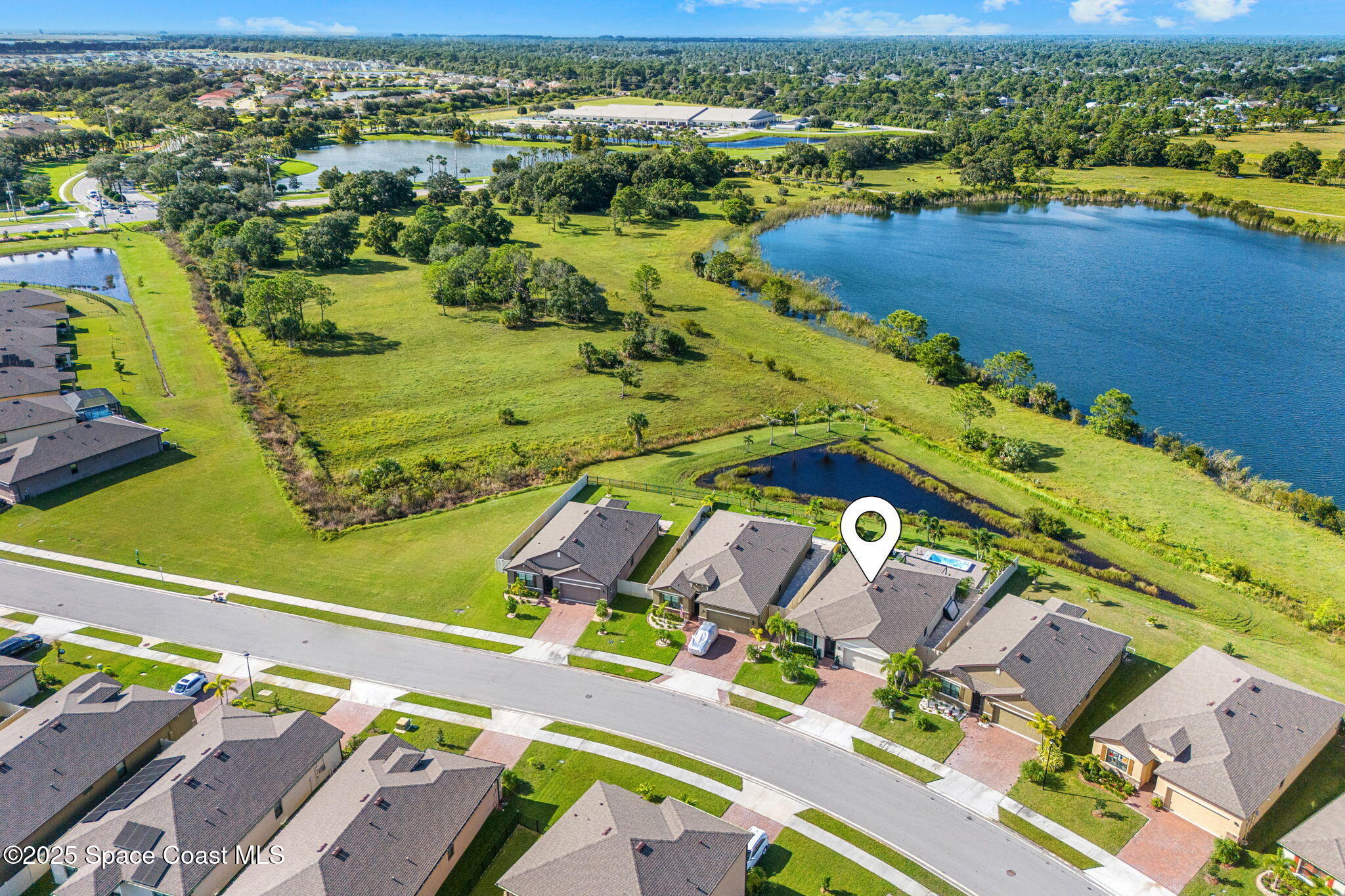 2013 Farmhouse Road Southeast Palm Bay, FL 32909 - Photo 35 of 37 an aerial view of residential houses with outdoor space
