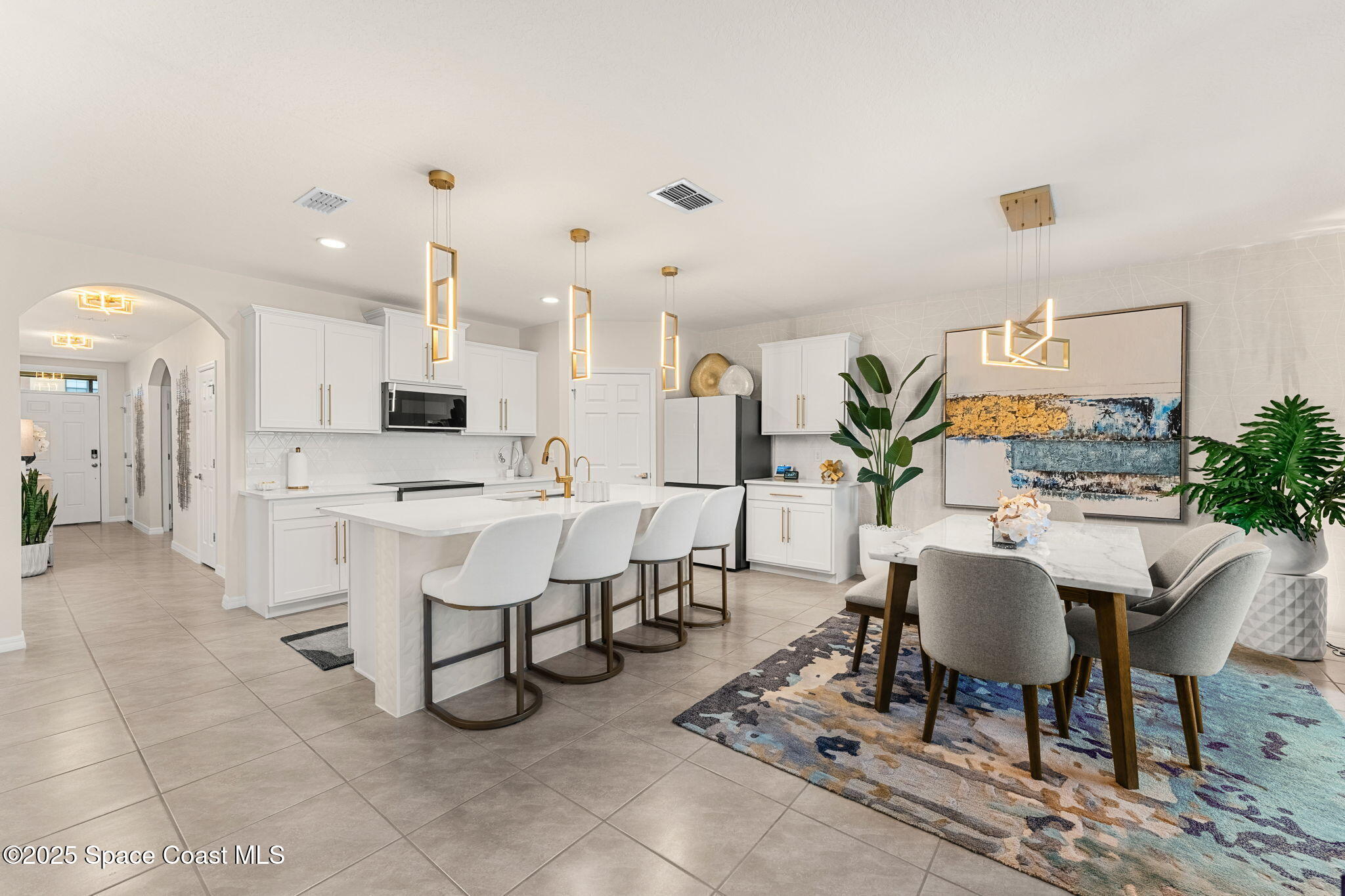 2013 Farmhouse Road Southeast Palm Bay, FL 32909 - Photo 5 of 37 a view of kitchen with dining table and chairs