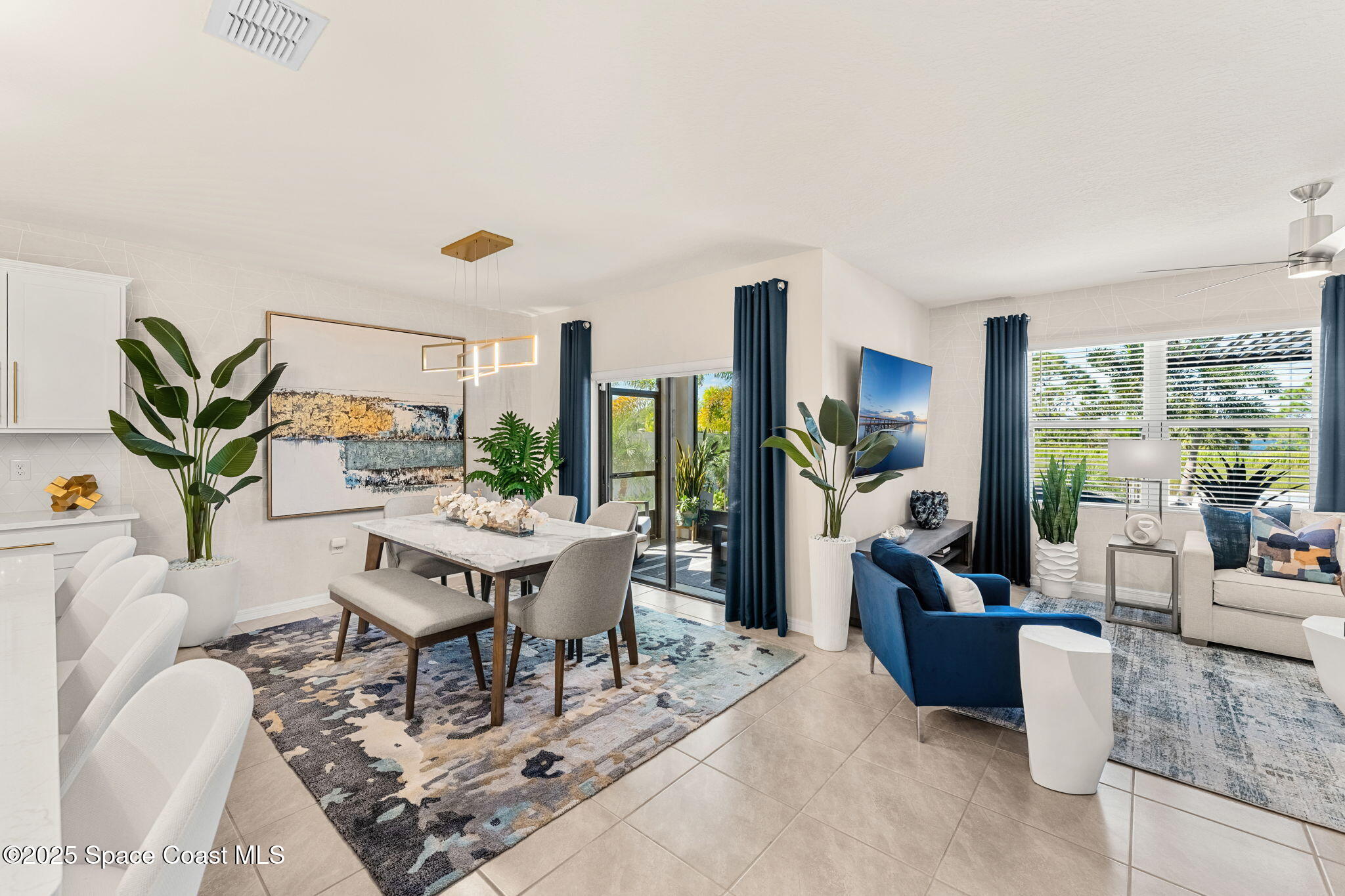 2013 Farmhouse Road Southeast Palm Bay, FL 32909 - Photo 6 of 37 a living room with furniture a large window and a table