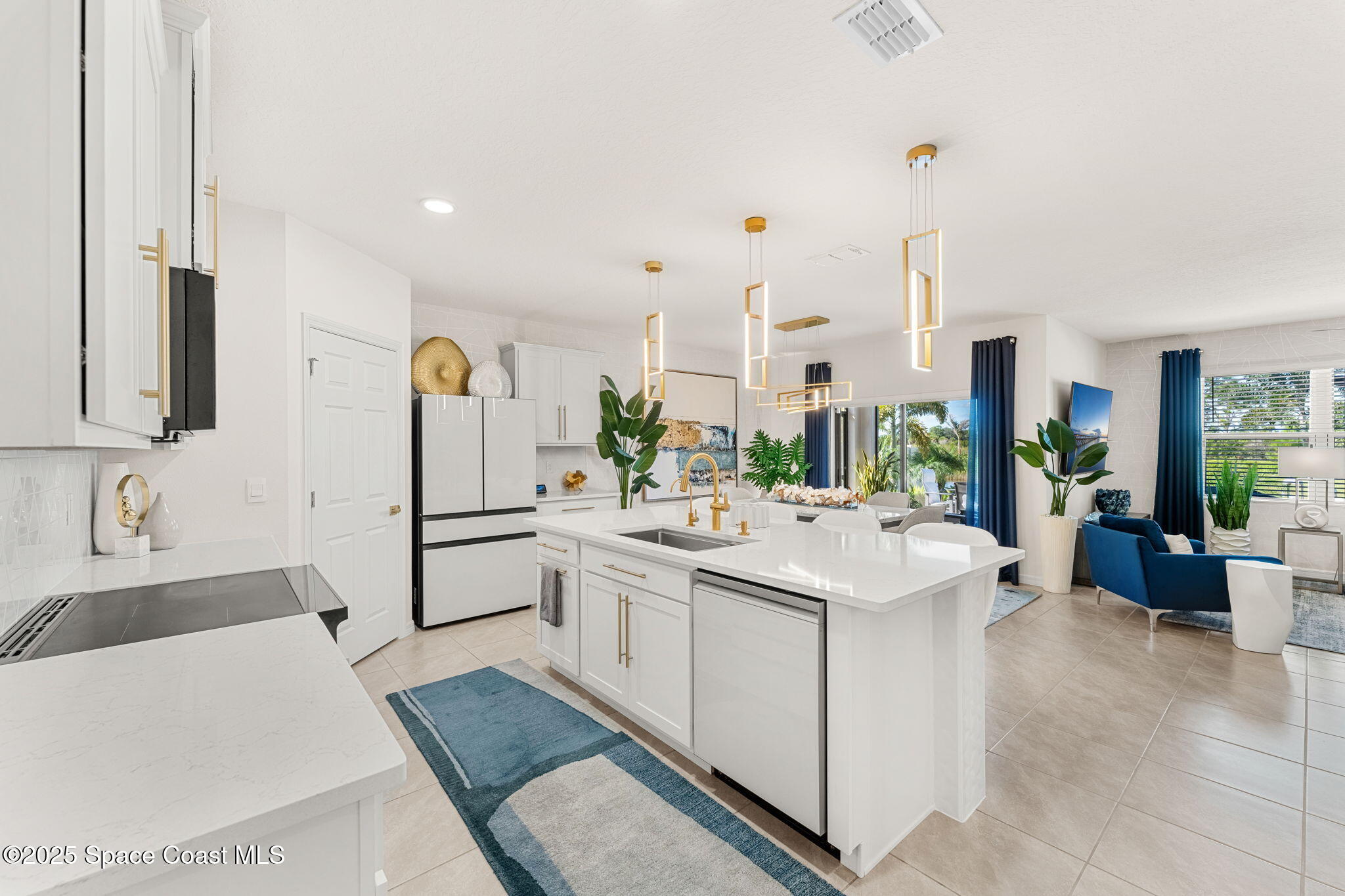 2013 Farmhouse Road Southeast Palm Bay, FL 32909 - Photo 10 of 37 a kitchen with a sink and white cabinets