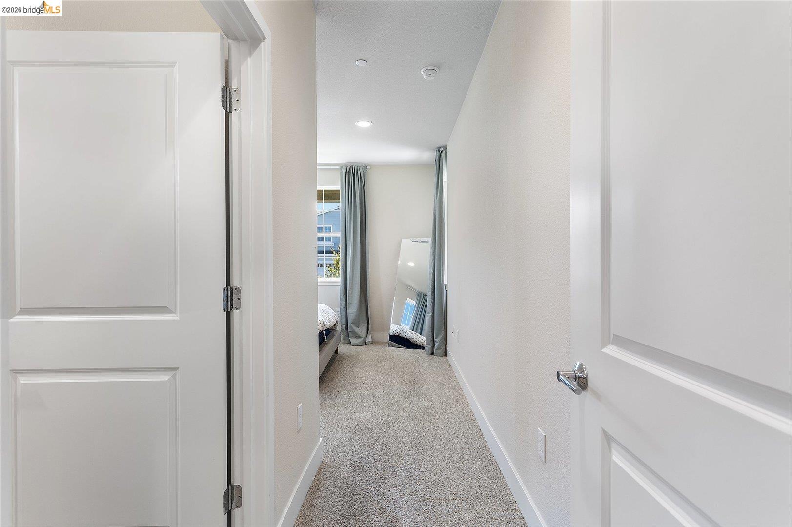 5601 Ridgepoint Way Antioch, CA 94531 - Photo 21 of 59 Hallway with light gray carpeting and white baseboards