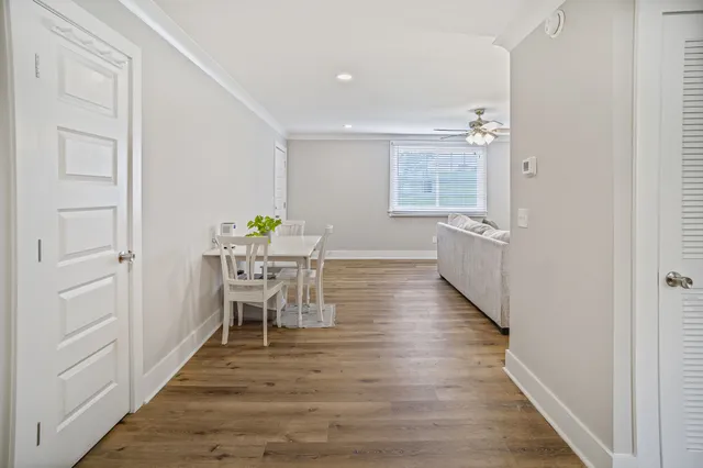 a view of a dining room with furniture and wooden floor