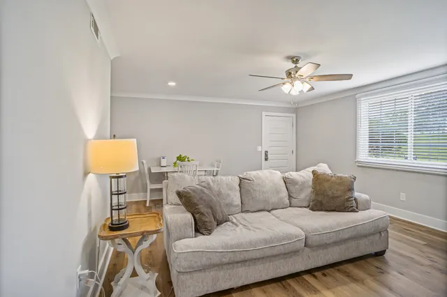 a living room with furniture and a window