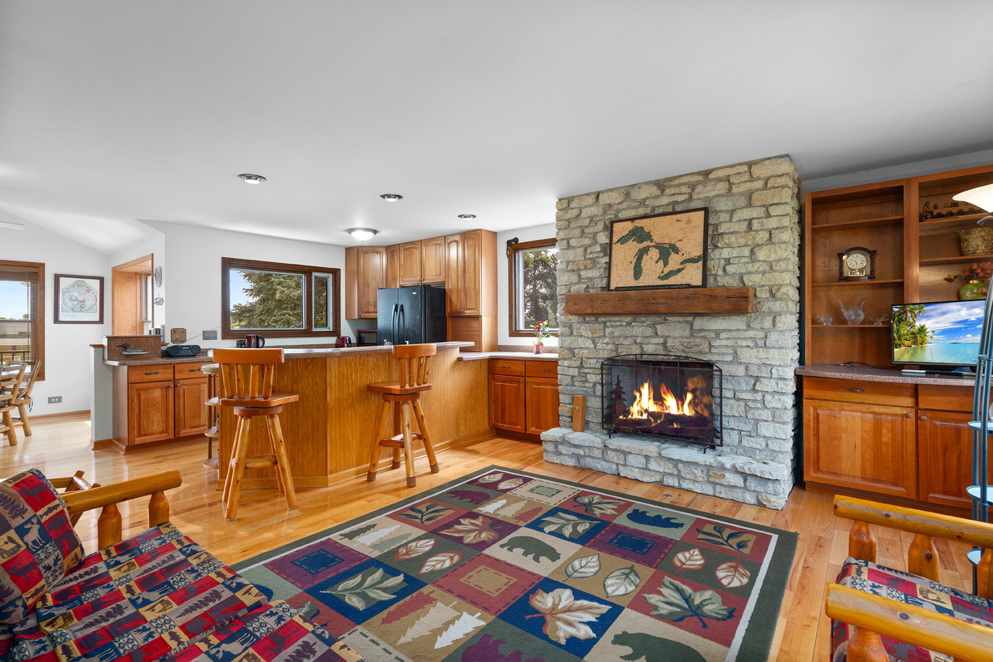 46 Feece Drive Batavia, IL 60510 - Photo 8 of 37 a living room with furniture a flat screen tv and a fireplace