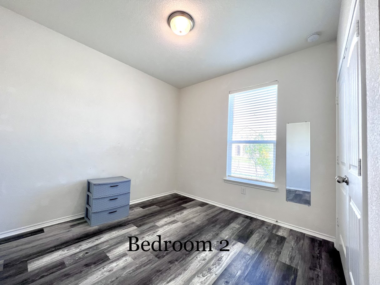 7900 Crystalbrook West Austin, TX 78724 - Photo 6 of 27 an empty room with wooden floor and windows