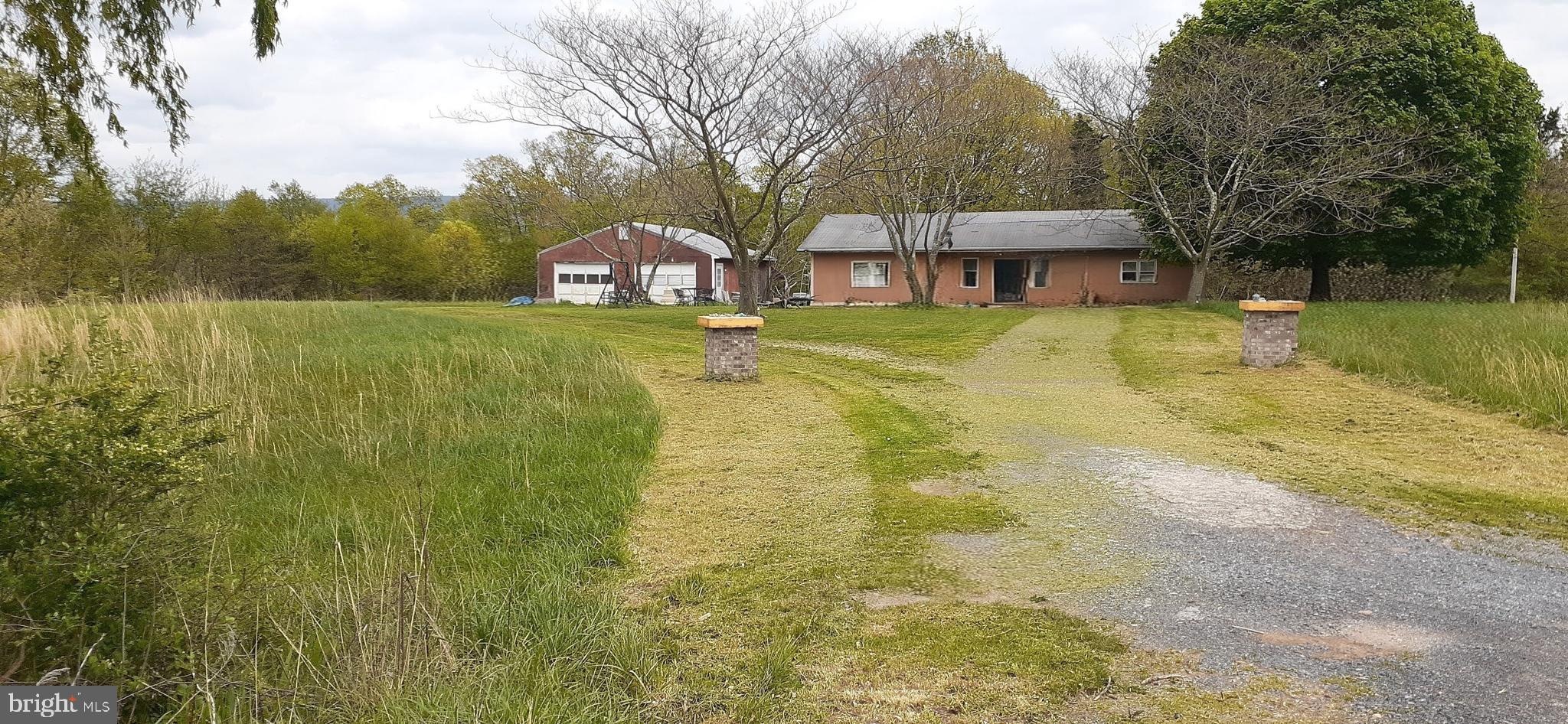 a view of a house with a yard