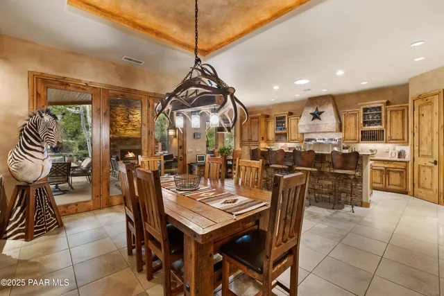a kitchen with a table and chairs in it