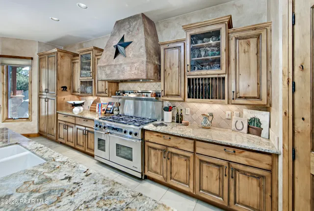 a room with granite countertop furniture and a window