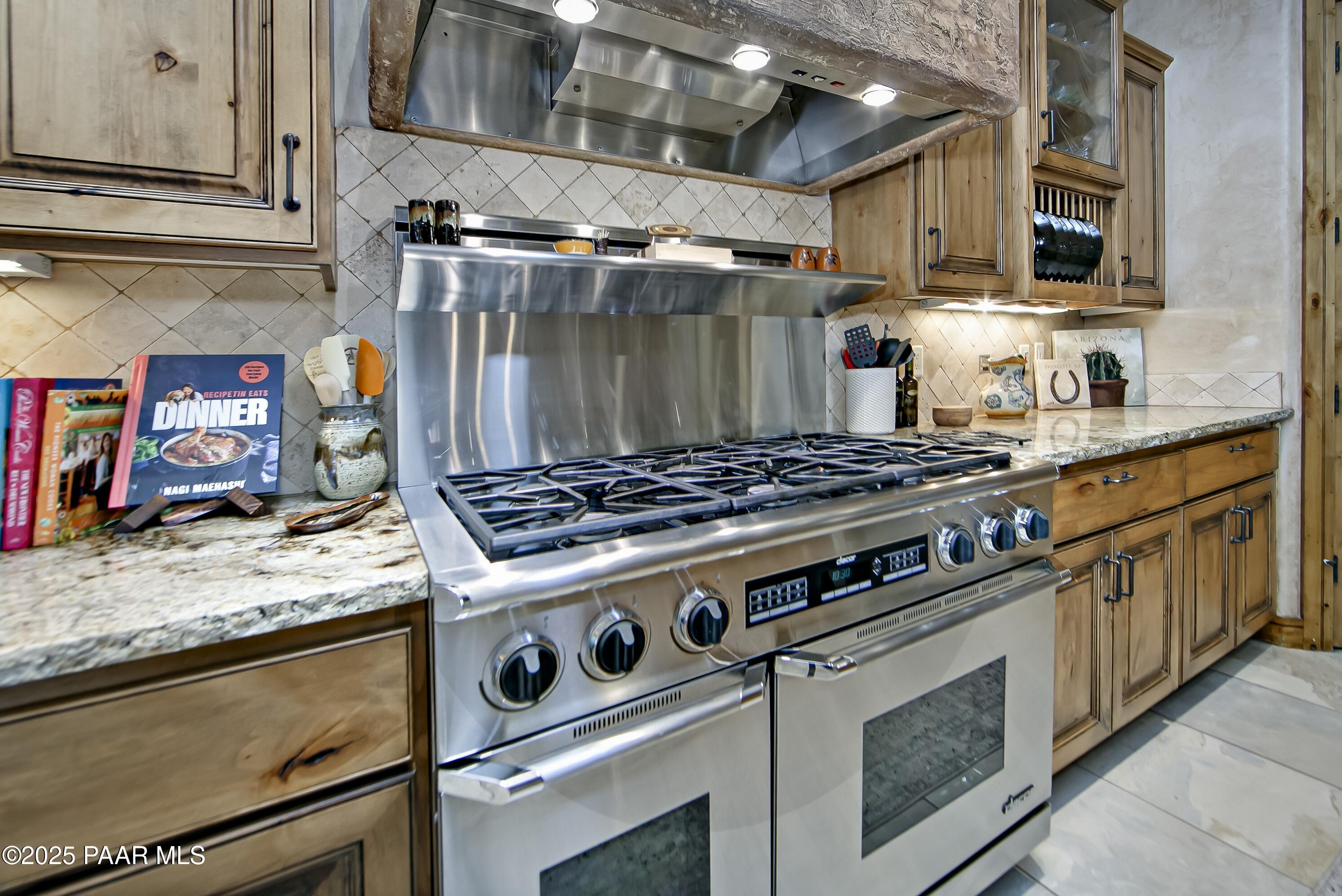 5110 Indian Camp Road Prescott, AZ 86305 - Photo 21 of 79 a stove top oven sitting inside of a kitchen