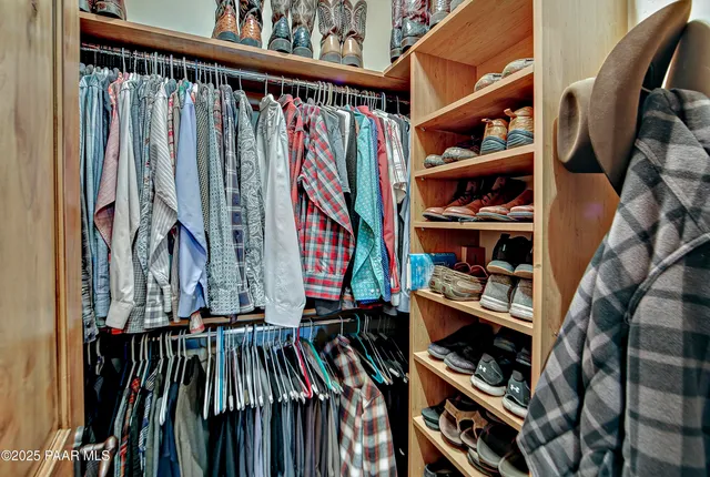 a bathroom with a granite countertop toilet a sink and a mirror