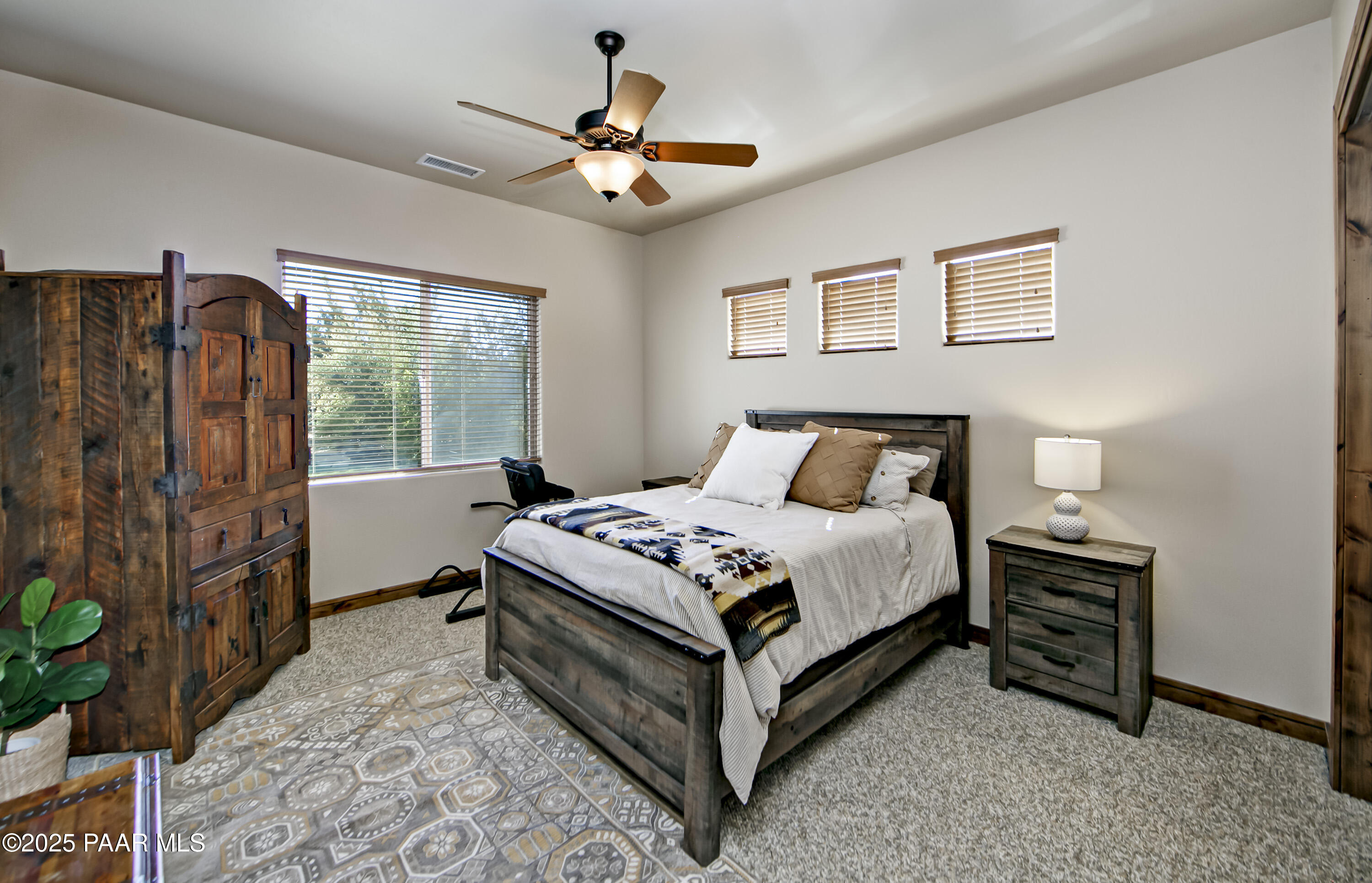 5110 Indian Camp Road Prescott, AZ 86305 - Photo 34 of 79 a bedroom with a bed and a chandelier