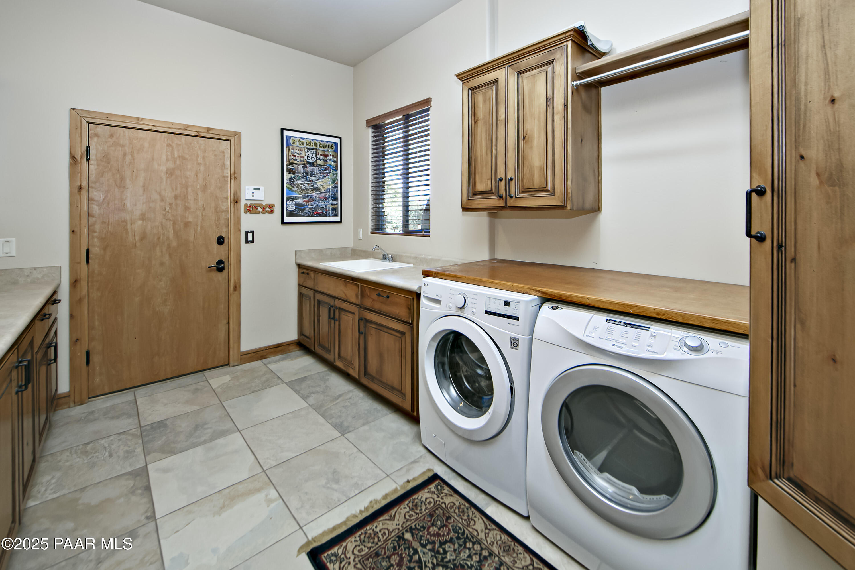 5110 Indian Camp Road Prescott, AZ 86305 - Photo 38 of 79 a view of a storage and utility room with washer and dryer