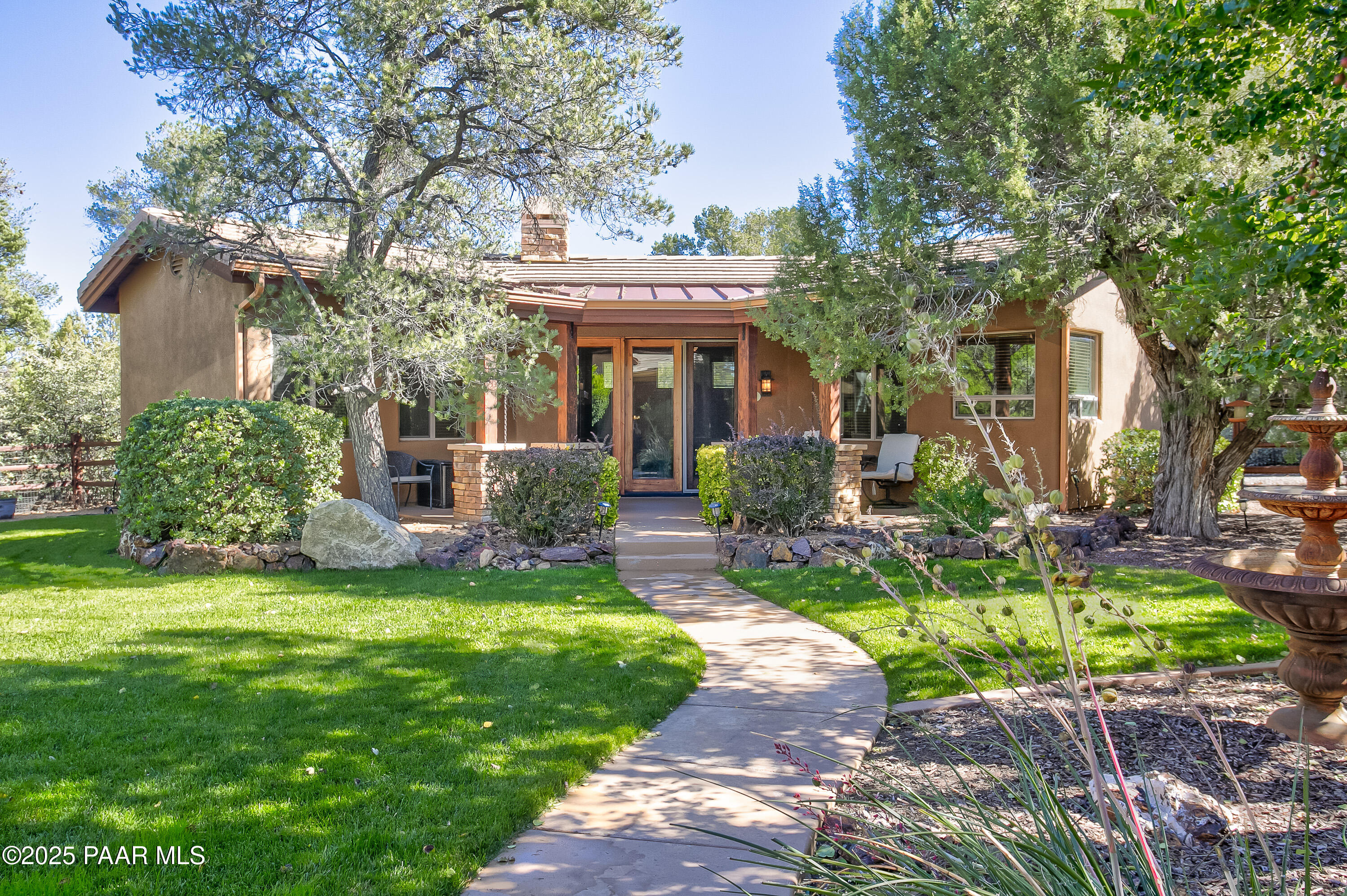 5110 Indian Camp Road Prescott, AZ 86305 - Photo 39 of 79 a front view of a house with a garden and plants