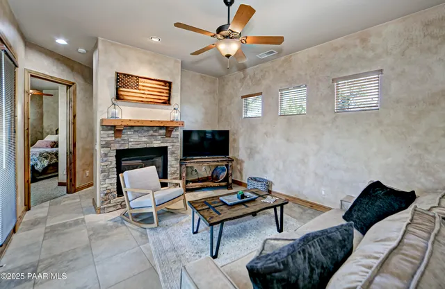 an aerial view of residential houses with outdoor space and trees