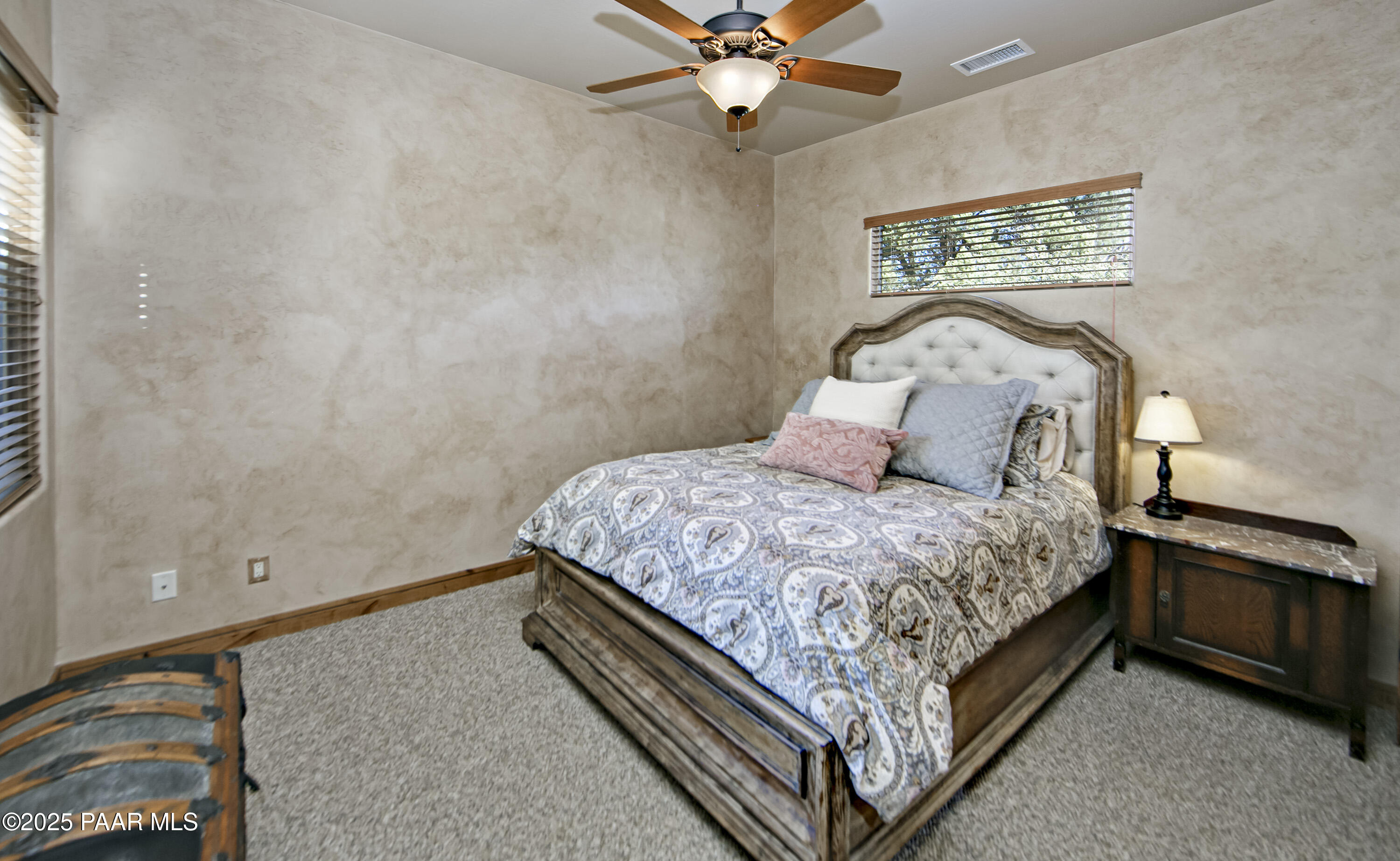 5110 Indian Camp Road Prescott, AZ 86305 - Photo 44 of 79 a bedroom with a bed and a chandelier