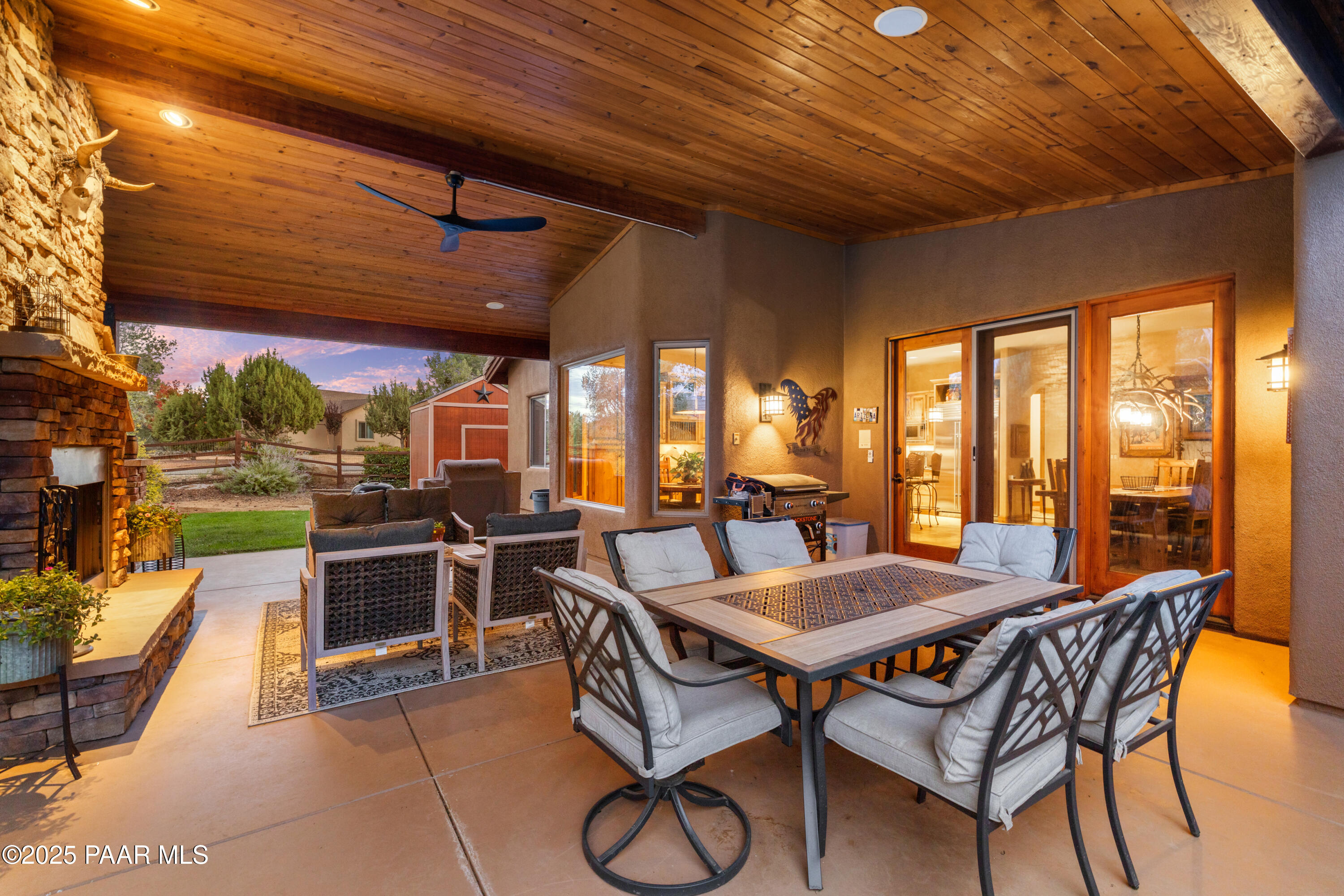 5110 Indian Camp Road Prescott, AZ 86305 - Photo 64 of 79 a view of a patio with a dining table and chairs with a barbeque grill
