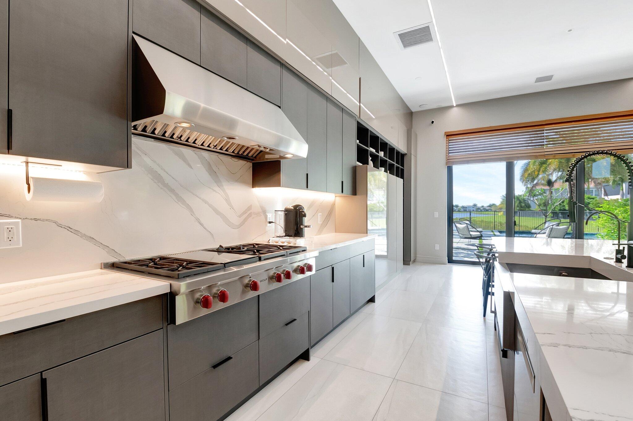 17353 Rosella Road Boca Raton, FL 33496 - Photo 25 of 103 a kitchen with stainless steel appliances granite countertop a stove and a sink