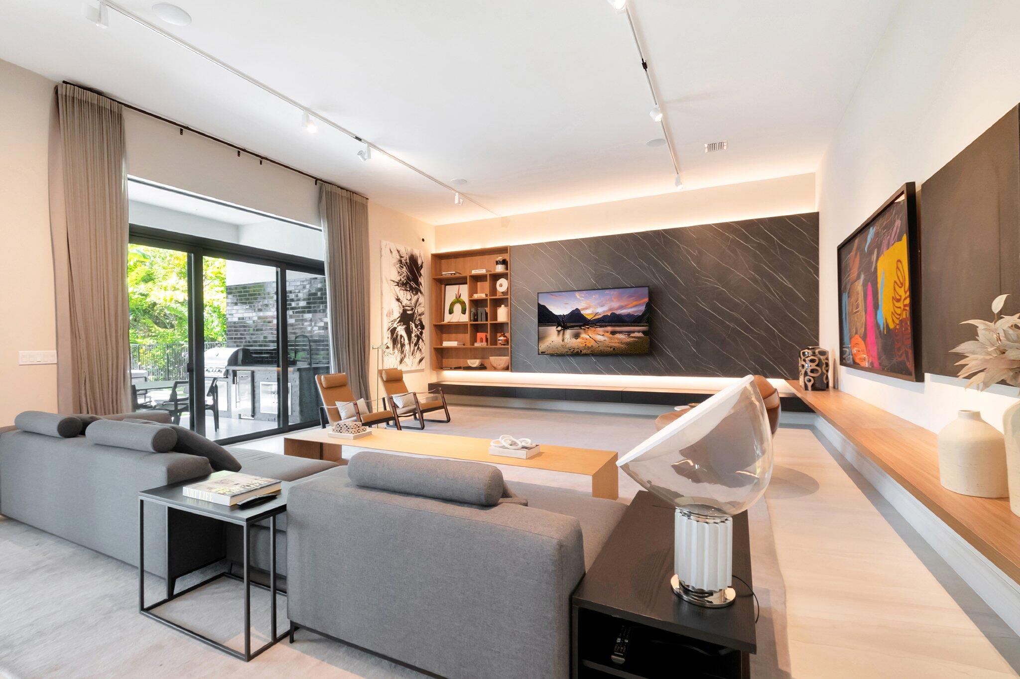 17353 Rosella Road Boca Raton, FL 33496 - Photo 27 of 103 a living room with furniture and a flat screen tv