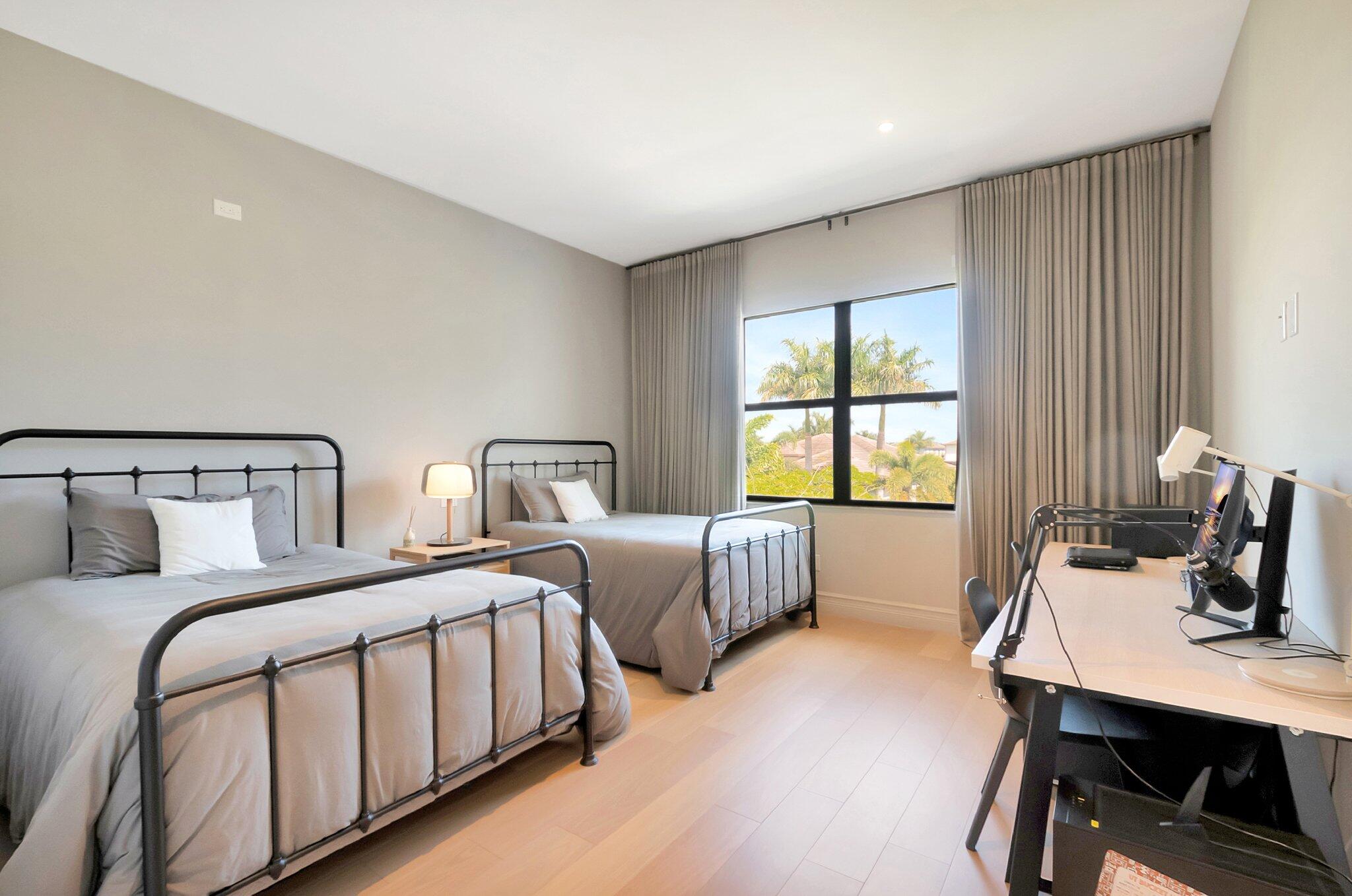 17353 Rosella Road Boca Raton, FL 33496 - Photo 53 of 103 a bedroom with two beds and a table