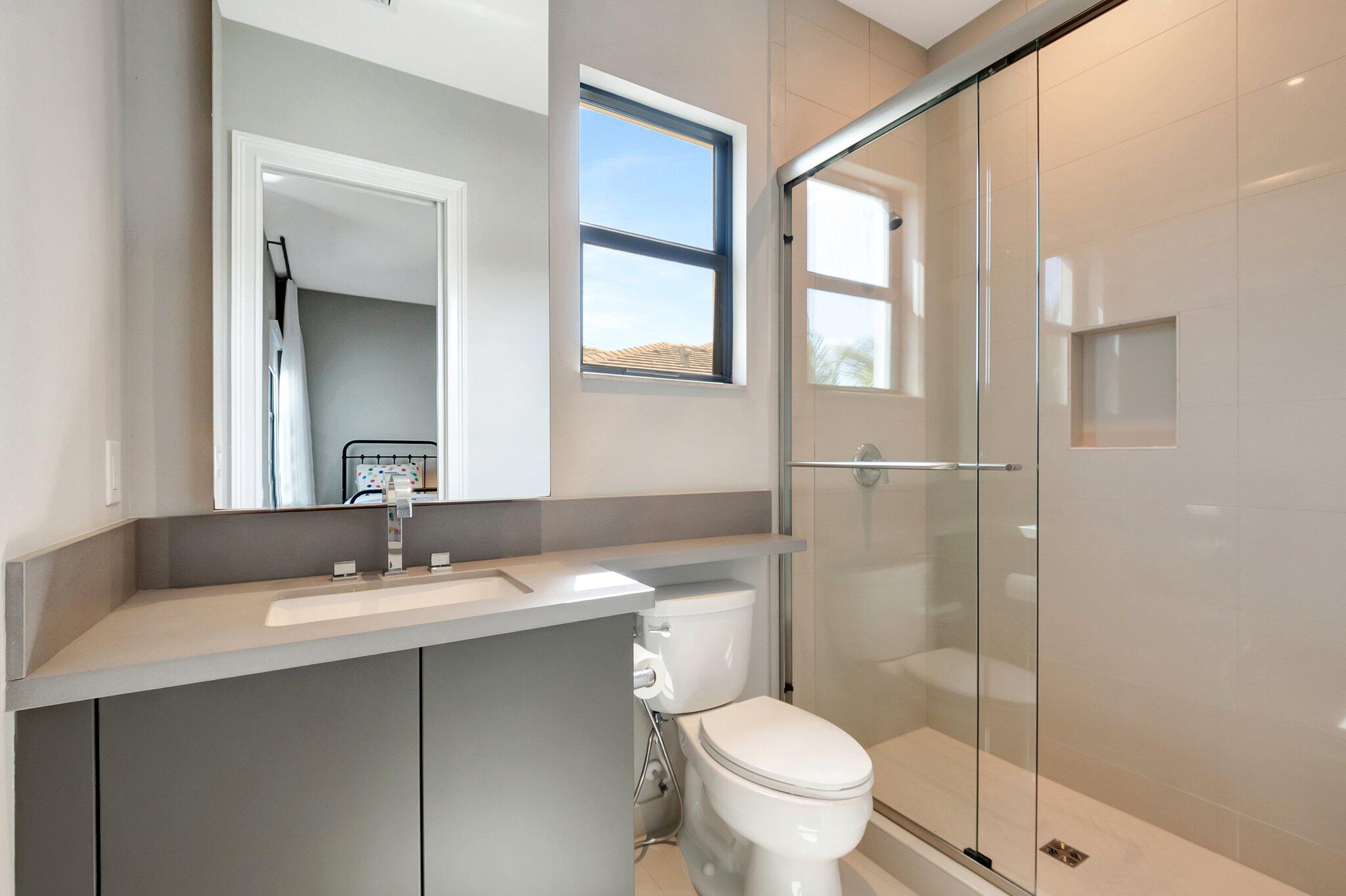 17353 Rosella Road Boca Raton, FL 33496 - Photo 59 of 103 a bathroom with a sink toilet and shower