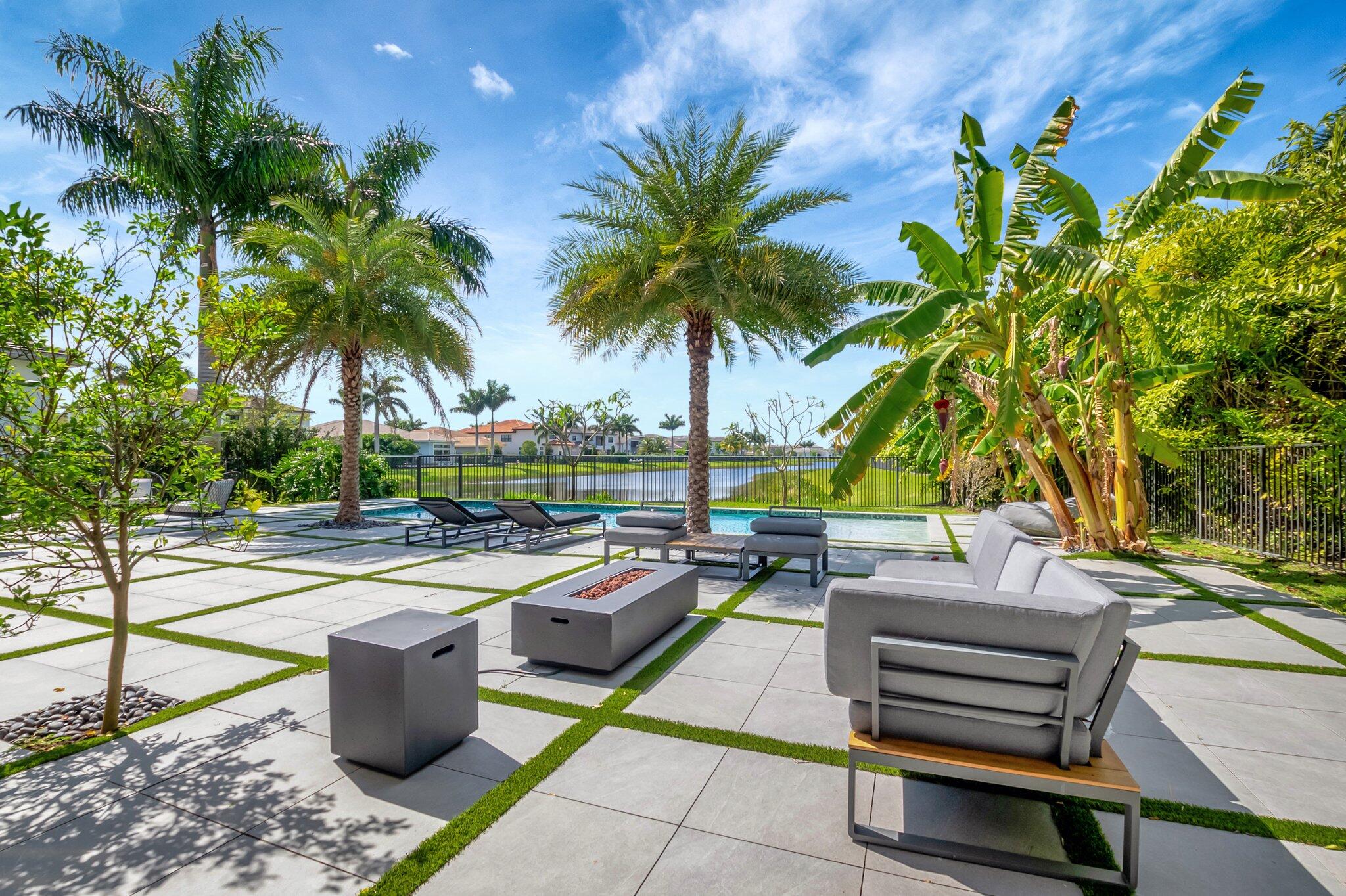 17353 Rosella Road Boca Raton, FL 33496 - Photo 64 of 103 a view of swimming pool with outdoor seating and plants