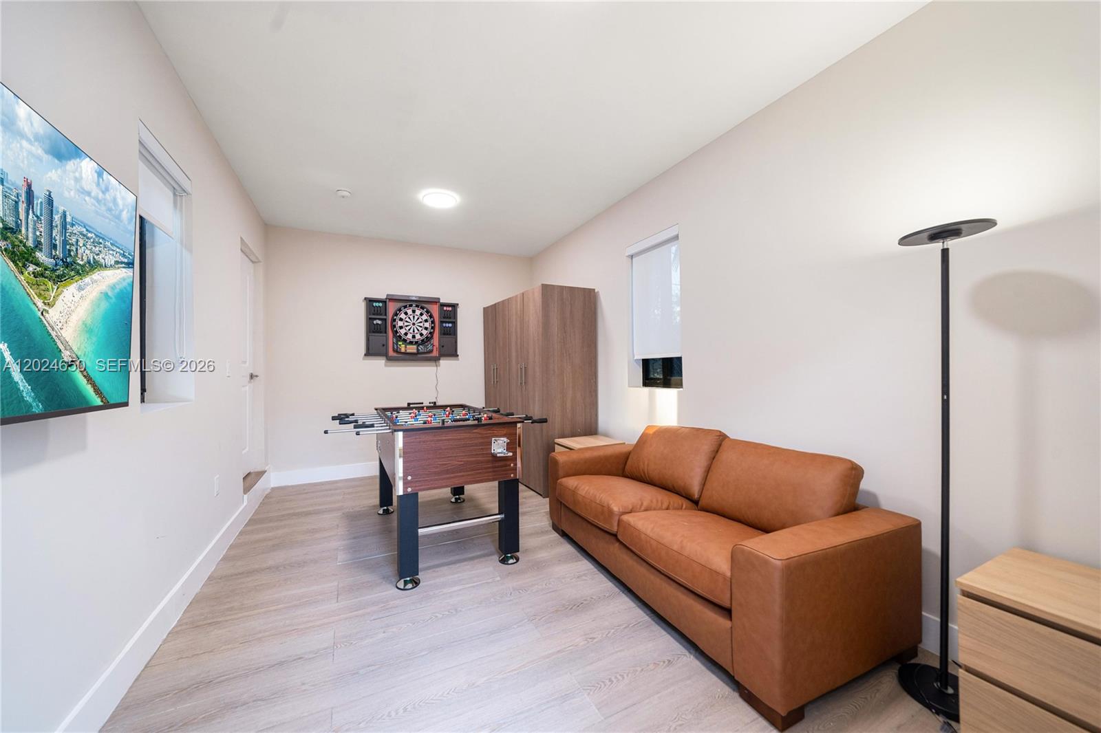 1663 Southwest 13th Street Miami, FL 33145 - Photo 13 of 112 a living room with furniture and a flat screen tv