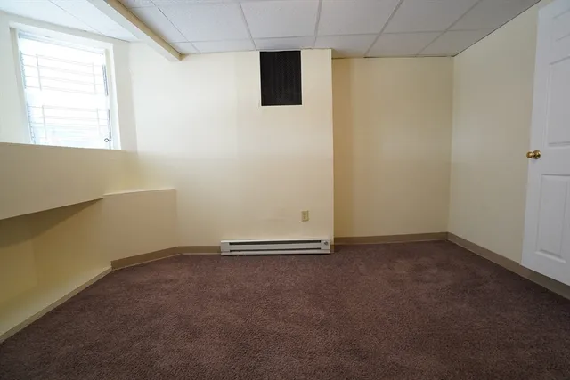 an empty room with a empty space and a window