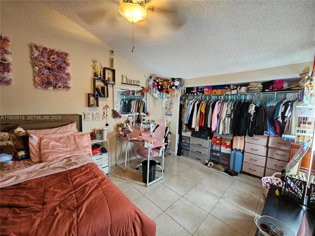 a bed room with a bed and a walk in closet