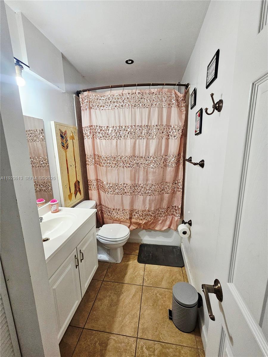 8401 West Sample Road, Unit 10 Coral Springs, FL 33065 - Photo 17 of 17 a bathroom with a sink toilet and shower